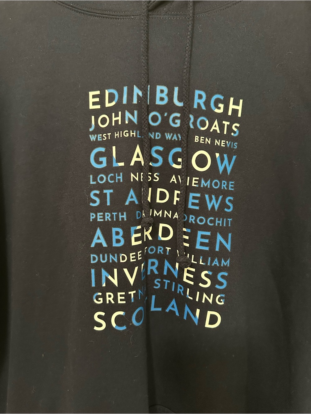Scotland City Names Graphic Hoodie - Blue with Blue & Yellow Text